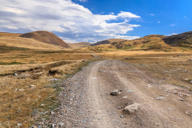 istock Amazing summer landscape with mountain road and blue sky with cl 884967792