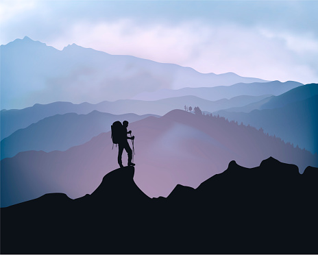 Traveler engaged in trekking in the background of mountains. Sunrise landscape