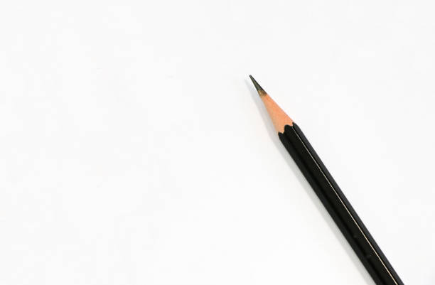 istock Sharp pencil black color put on blank white paper 884980420