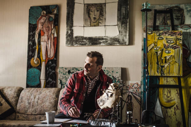 istock Artist Drawing In His Studio 884992660