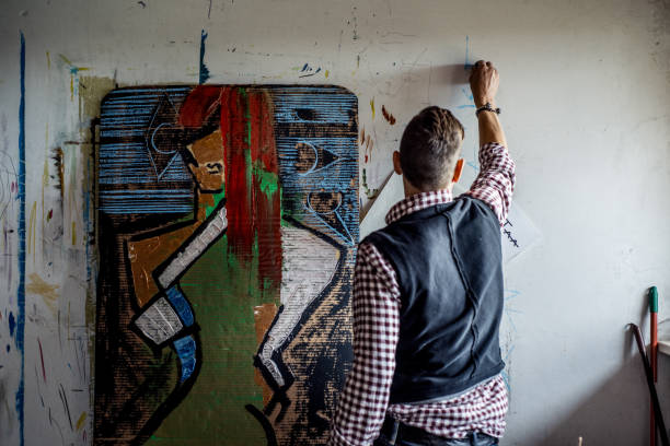 Artist Working On His Painting In Art Studio