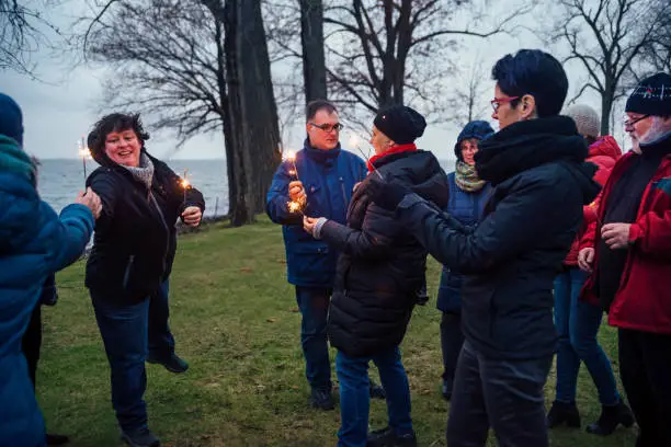 Photo of Friends and family celebrating life of cancer patient outdoors winter