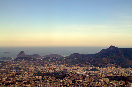 Aerial view of Rio de Janeiro, with Cristo Redentor, Pão de Açucar, Maracanã stadium and Guanabara bay in the photo, in late autumn.