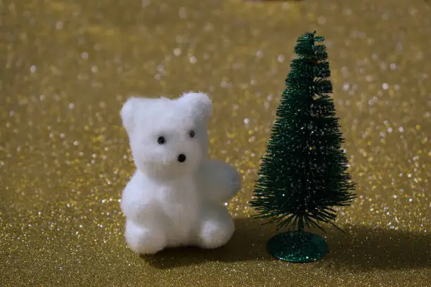 Christmas ornaments, little white teddy bear and Christmas tree.