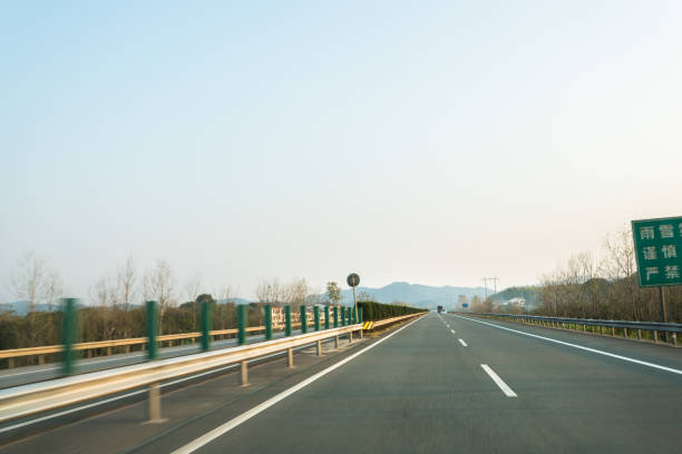 istock highway in motion blur under sunny day 885088822