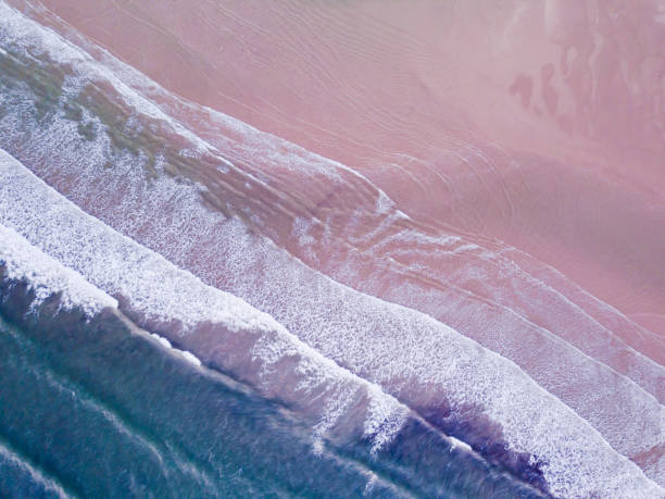 istock Aerial View looking down on a Welsh Beach in the UK. 885102458