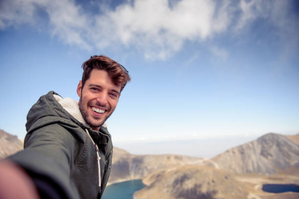 istock Man making a selfie at the top. 885107300