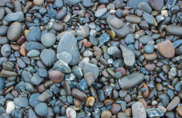 istock Polished colored marble pebbles and semi-precious stones background 885186926