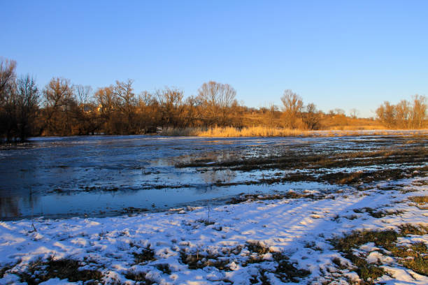istock Snow melting on the meadow 885191780
