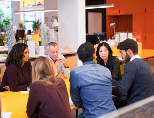 istock Multi-ethnic business people discussing in cafe 885191918