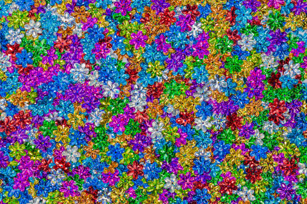 istock close up colorful flower glitter in pattern. flower shape glitters in top view 885202302