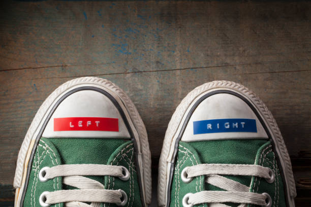 Right and left sneakers Right and left shoes. left wing politics stock pictures, royalty-free photos & images