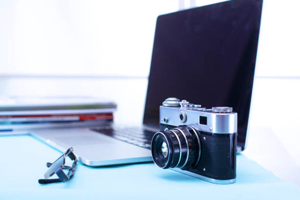 istock digital camera and colour swatches on an office desk 885226932