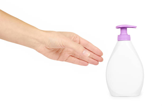 istock White hand sanitizer soap dispenser in hand isolated on white background. Housework and sanitary concept 885231688