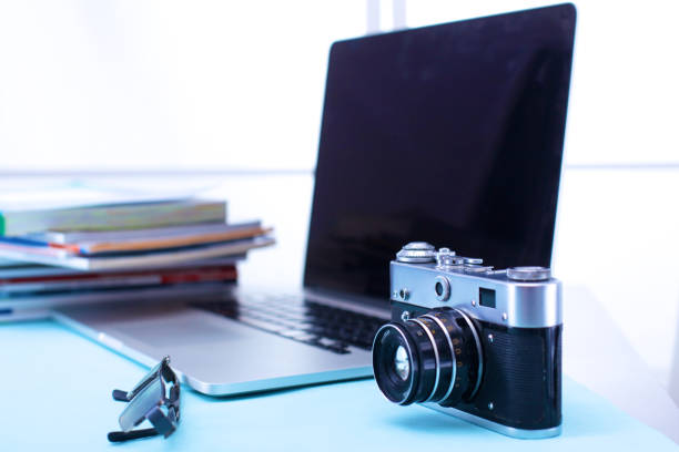 istock digital camera and colour swatches on an office desk 885231942
