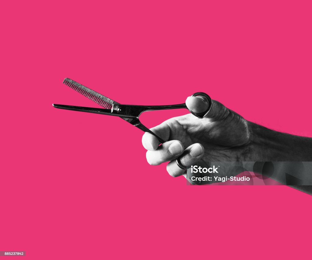 Japanese workman hands Man hand holding a Scissors on Colorful background Scissors Stock Photo