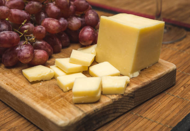White Cheese and Red Grapes stock photo