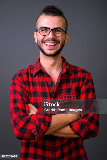 Portrait Of Turkish Man Against Gray Background Stock Photo - Download Image Now - 30-34 Years, Looking At Camera, Portrait