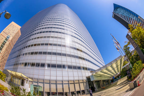 Tokyo, Japan - April 20, 2017: wide angle view of Dentsu Building the second tallest skyscraper in Shiodome of Minato, Tokyo, Japan, example of contemporary architecture. Fisheye shot.