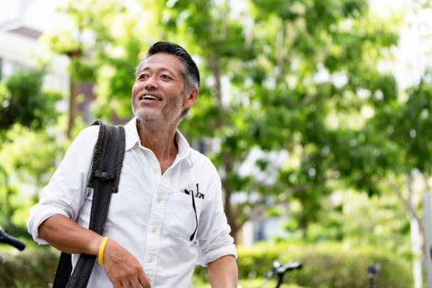 Cheerful Japanese man in a parking lot
