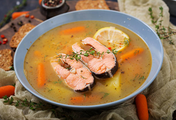 istock Salmon fish soup with vegetables in bowl. 885281484