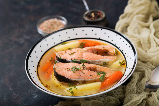 istock Salmon fish soup with vegetables in bowl. 885281530