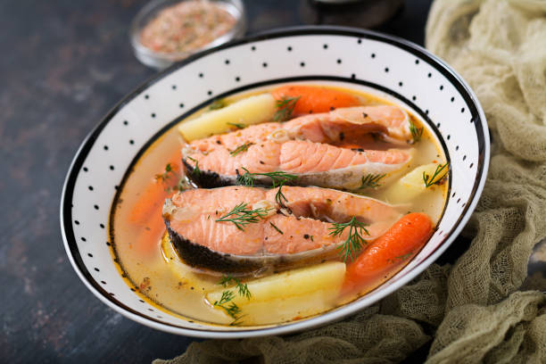 istock Salmon fish soup with vegetables in bowl. 885281546