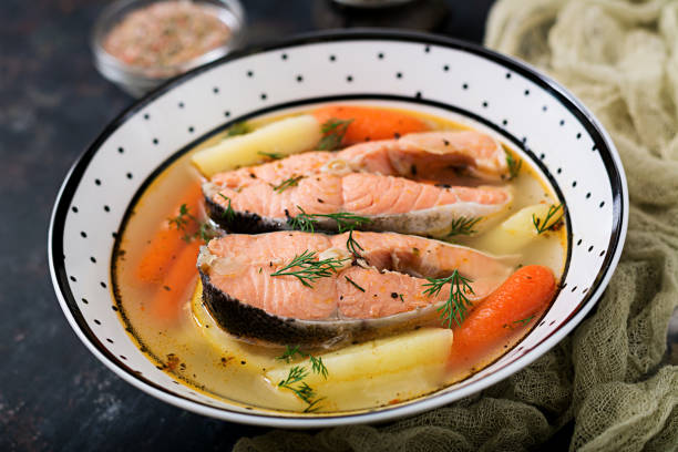 istock Salmon fish soup with vegetables in bowl. 885281548