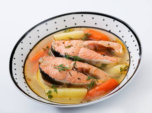 istock Salmon fish soup with vegetables in bowl. 885281562