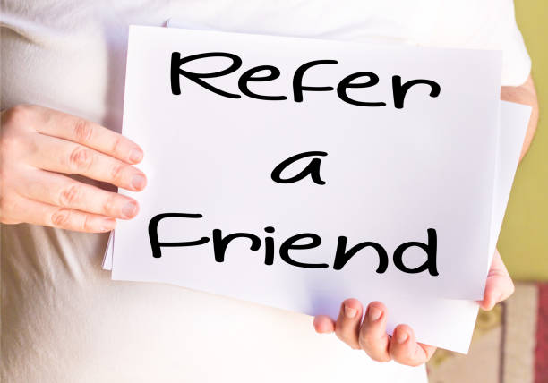 istock Refer a Friend card isolated on white paper 885311990