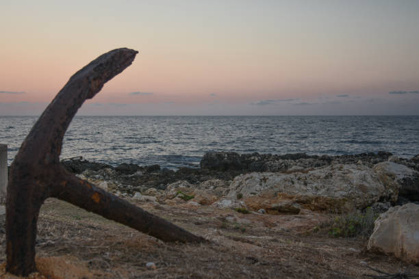 istock An isolated anchor near the sea 885314280
