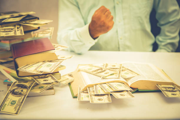 istock businessman is showing his money 885328102