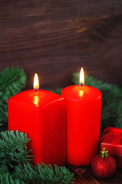 istock Burning candles with christmas decorations 885328448