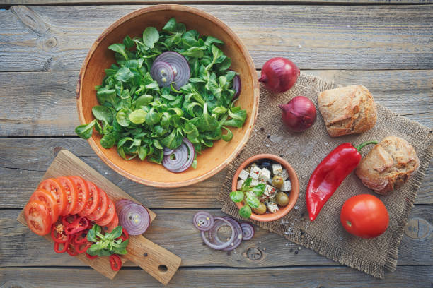 istock Ingredients for vegetables salad on a wooden background. 885328620