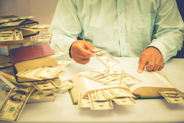 istock businessman is showing his money 885333706