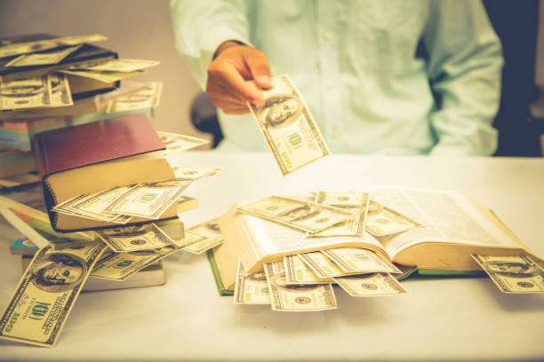 istock businessman is showing his money 885338424