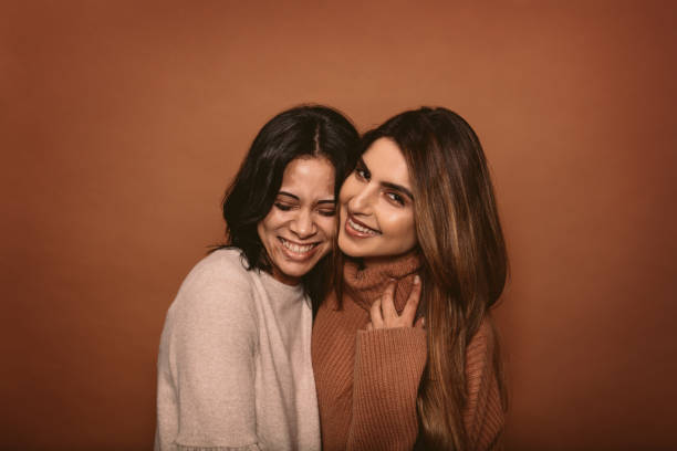 istock Happy female friends smiling together 885346178