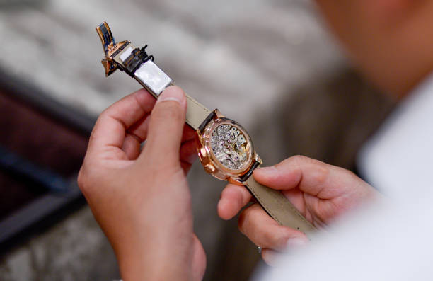 wrist watch with leather wristband strap on hand