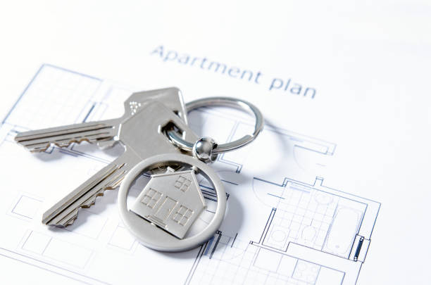istock House key on a house shaped pendant 885367800