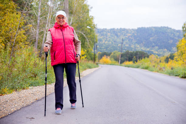 istock Senior lady nordic walking 885374472