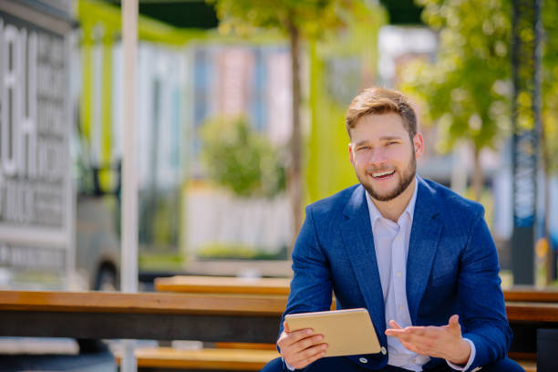 istock Young handsome businessman having coffee break 885378262
