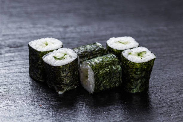 istock Cucumber maki on slate plate background 885383206