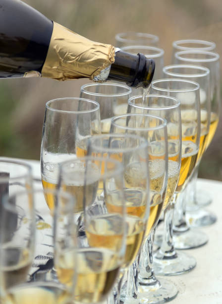 istock Sparkling Bottle Champagne glass with more glasses 885393896
