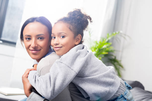 istock daughter hugging her mother 885394662