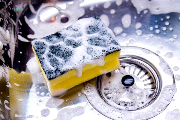 istock cleaning the sink in kitchen 885412144