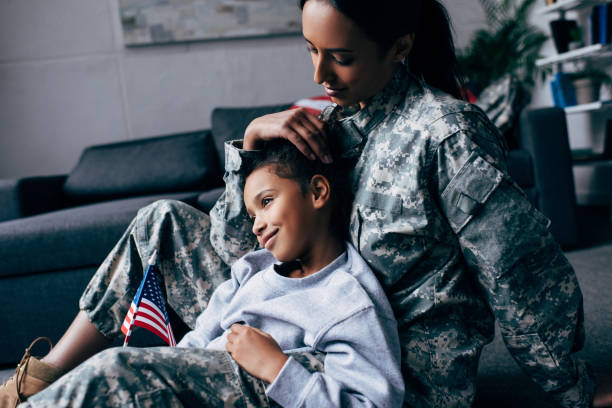 istock daughter and female soldier 885412322