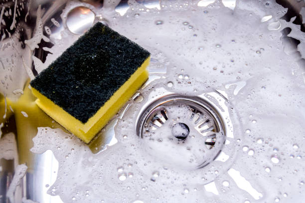 istock cleaning the sink in kitchen 885412356