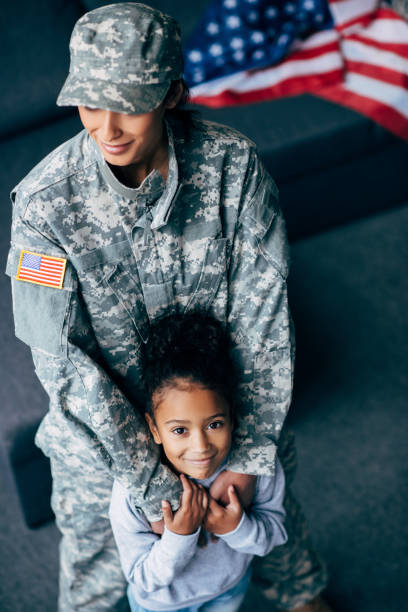 istock daughter and mother in military uniform 885414510