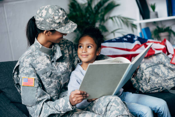 istock daughter and mother reading book 885414874