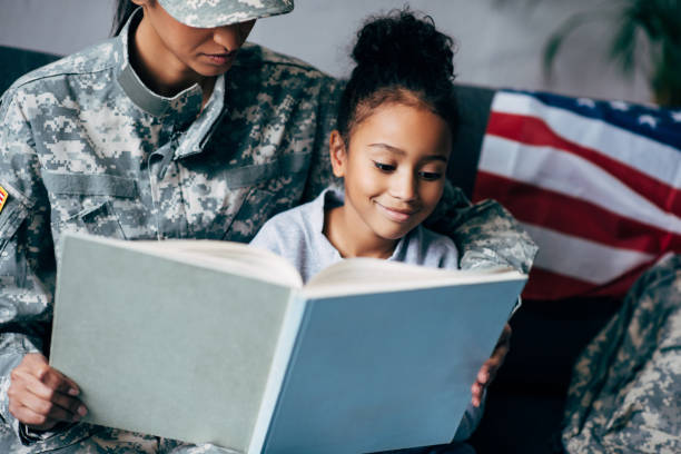 istock daughter and mother reading book 885414930